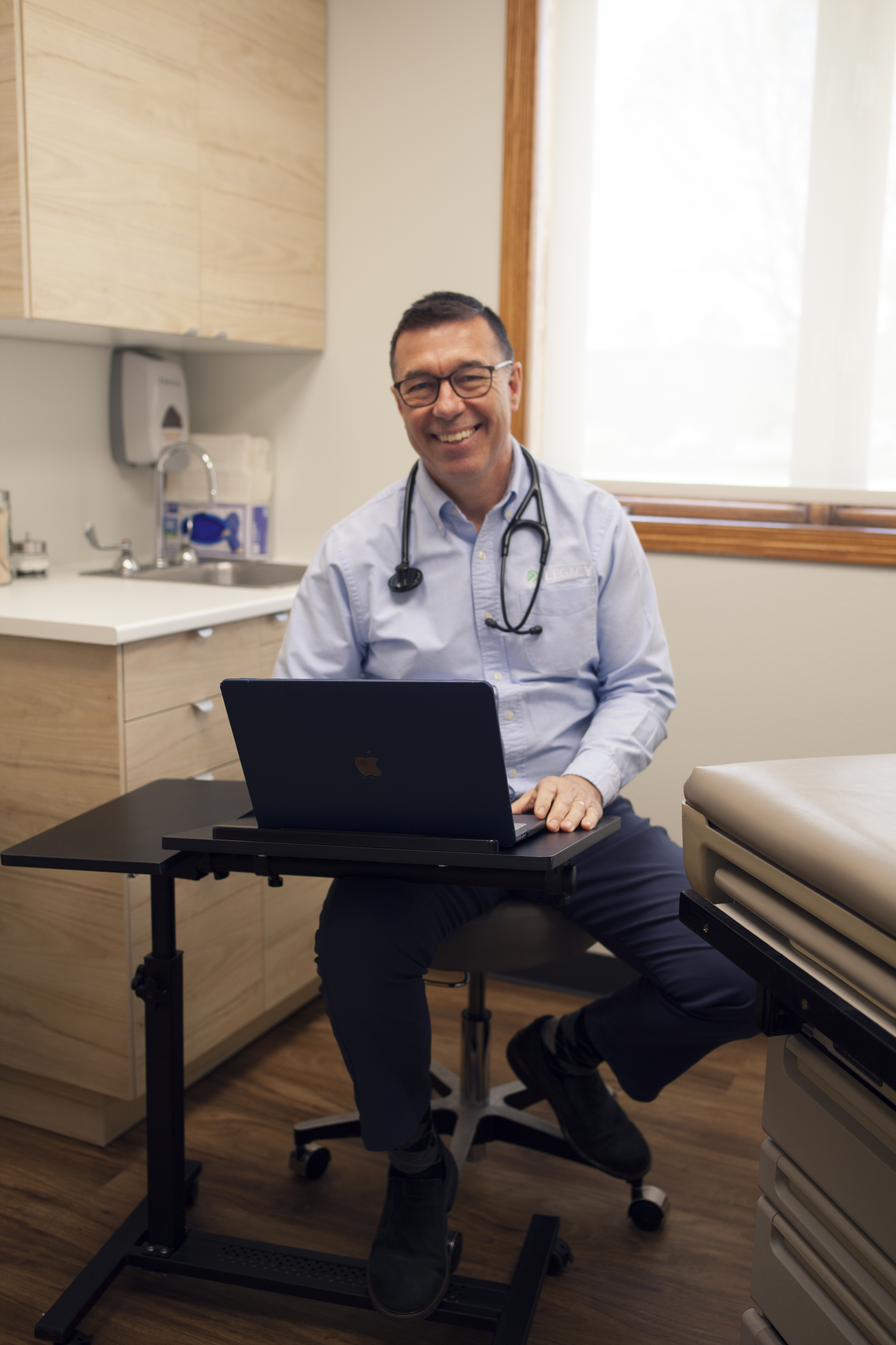 Dr. Eric Miller in a Legacy Medical Services exam room